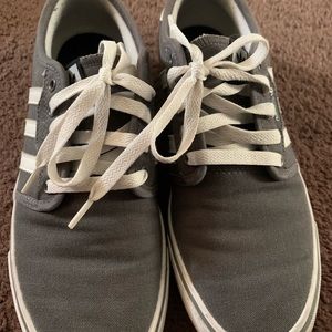 woman’s adidas, grey and white stripes